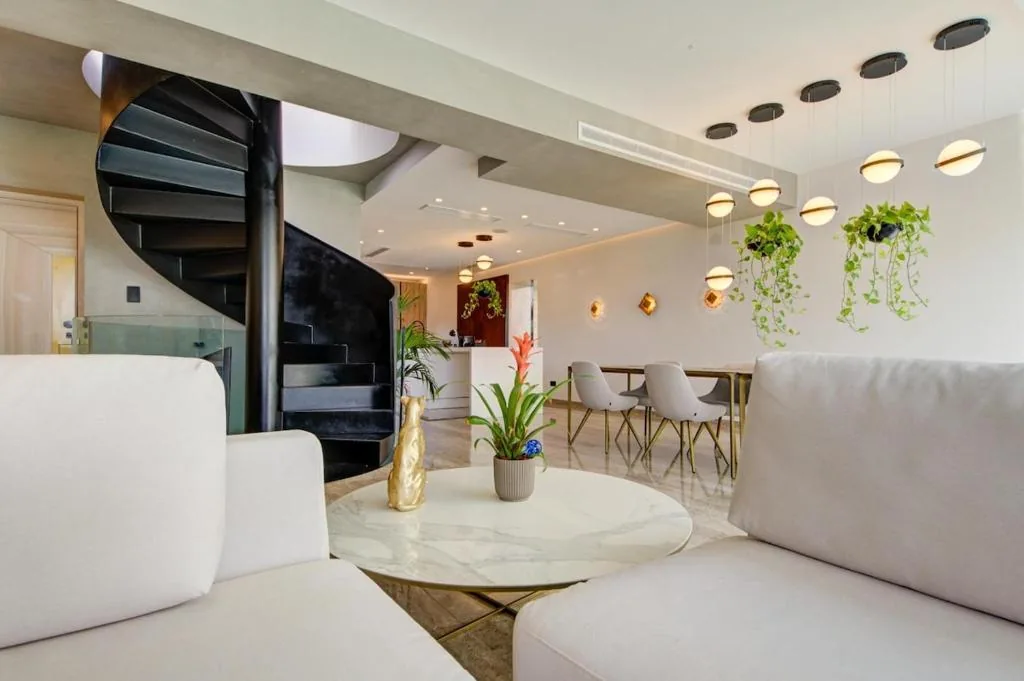 The black spiral stair between floors